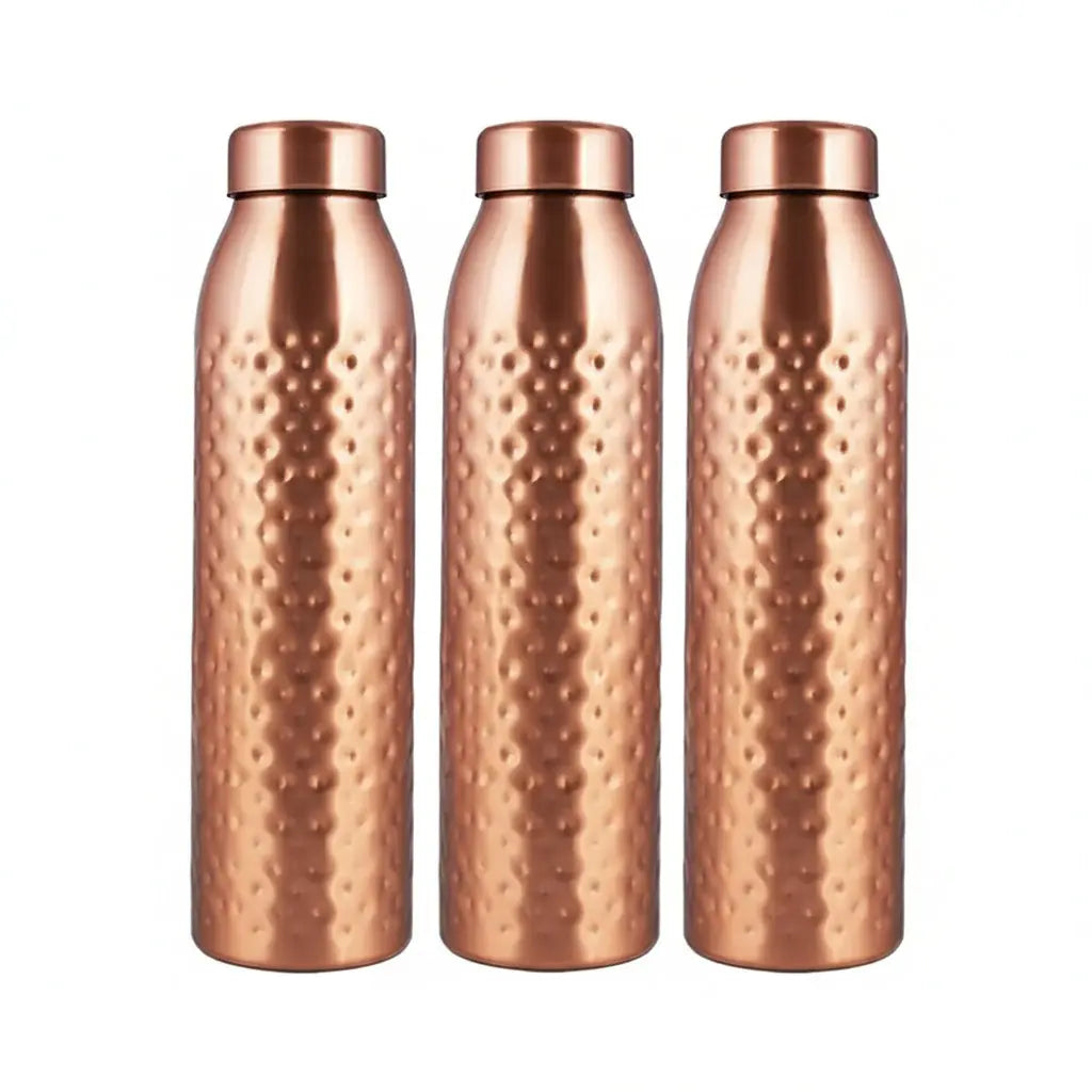 Three copper-colored water bottles with a textured surface in front of their packaging box.